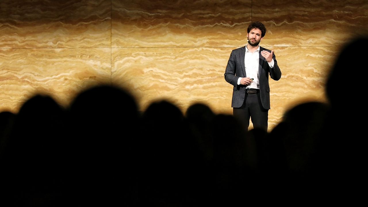 Jamie Susskind speaking on stage