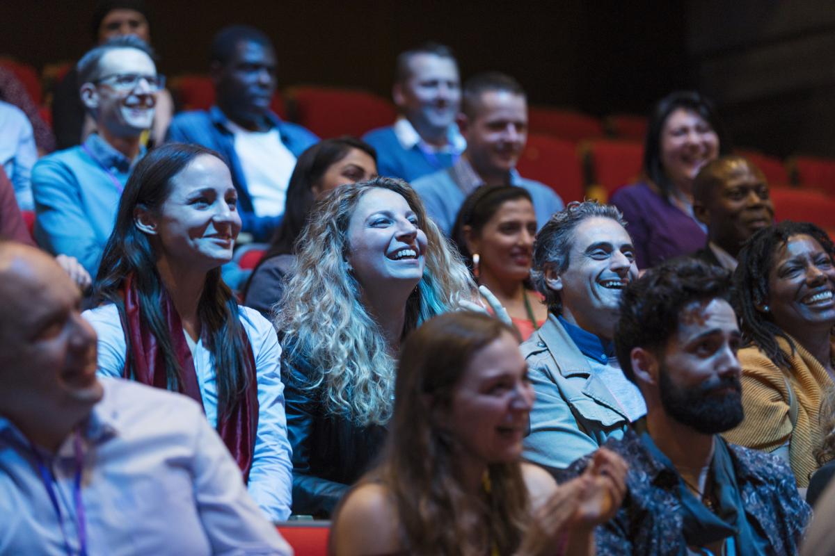Enthusiastic audience enjoying a conference