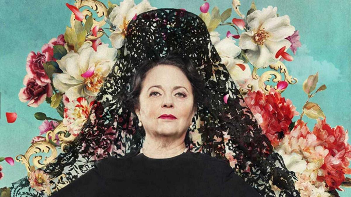 photo of a women with flowers behind
