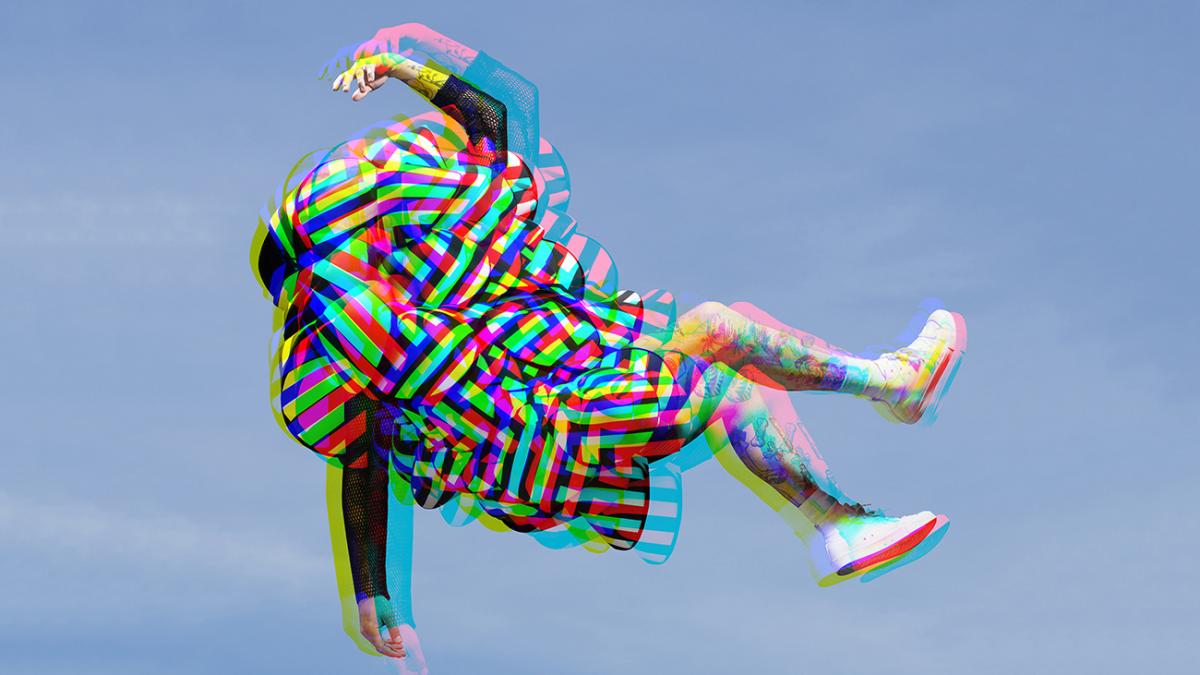 blurry photo of a person jumping against the sky