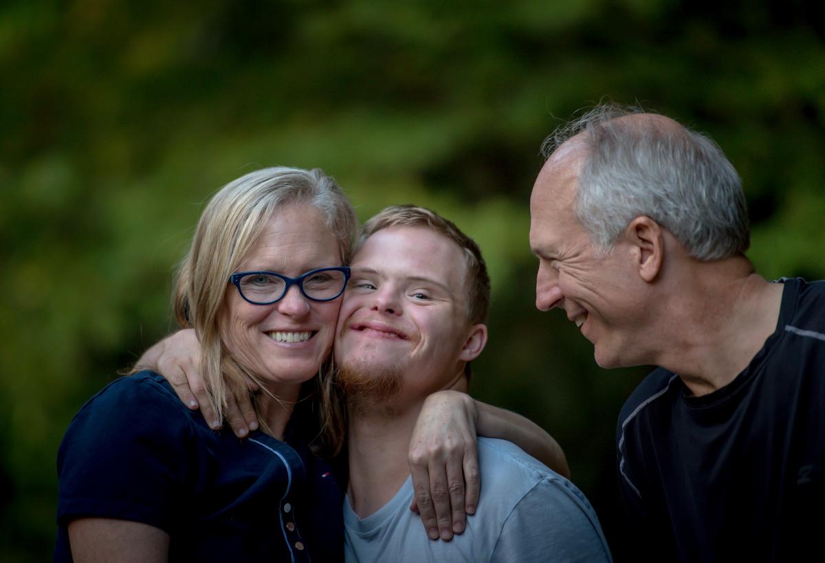 Image of a person with disability and support workers